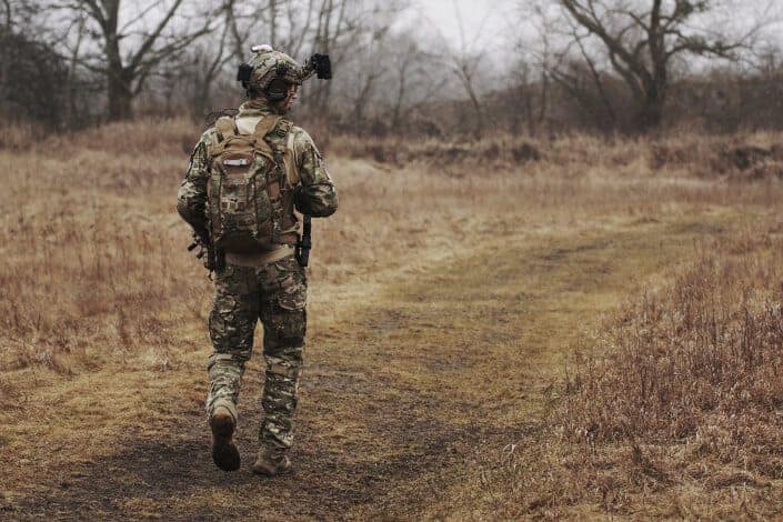 A soldier wandering through the wilderness.