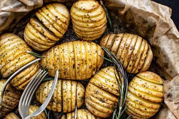 Roasted potatoes with thyme and forks