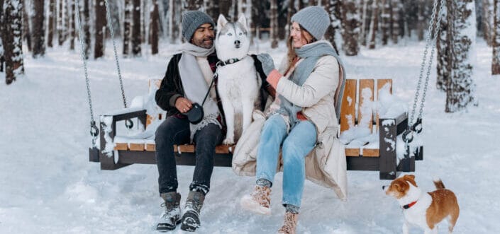 Couple playing with their dogs