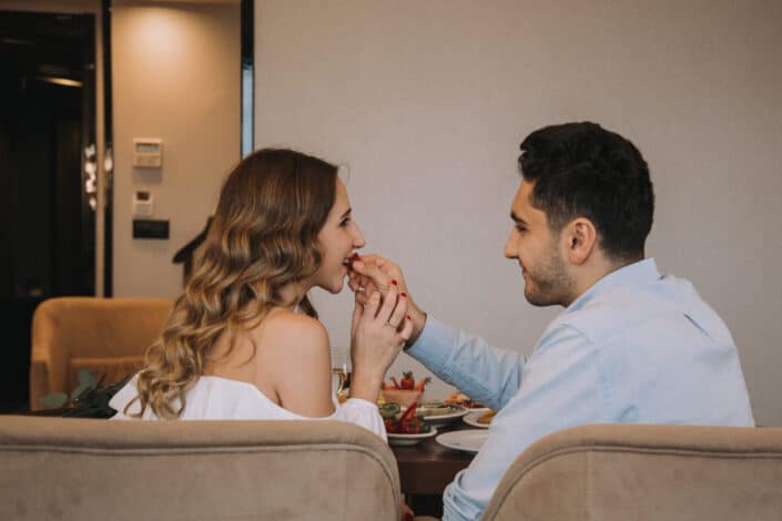 Sweet couple eating while on their date